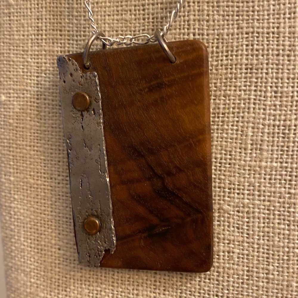 Unique wood and metal pendant.